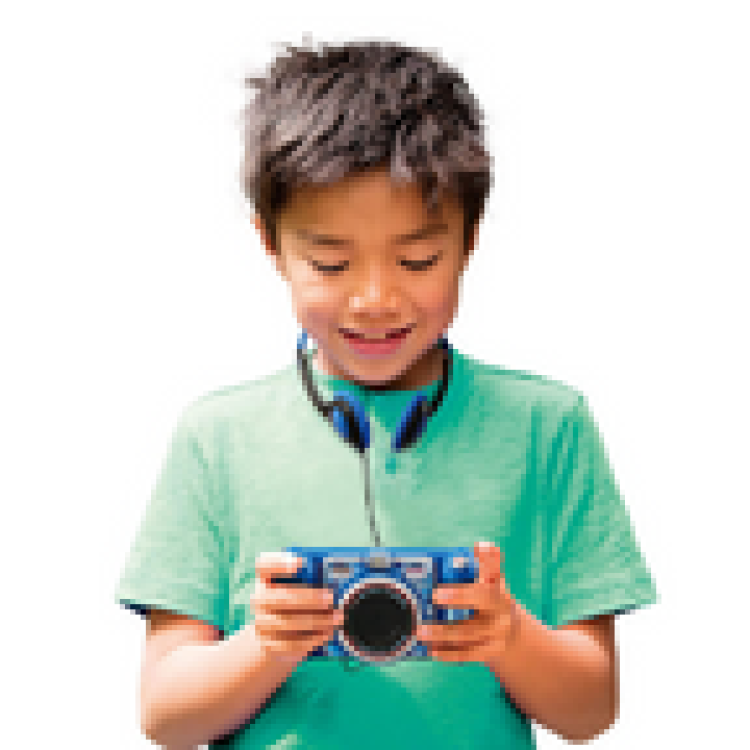 Boy using the Kidizoom Duo DX Camera 