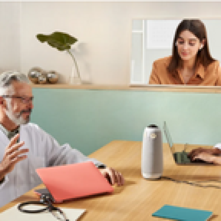 People using the Owl camera during a hybrid meeting
