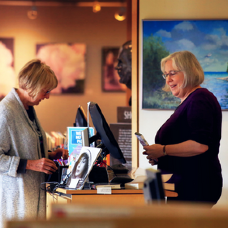 woman getting help at the circulation desk