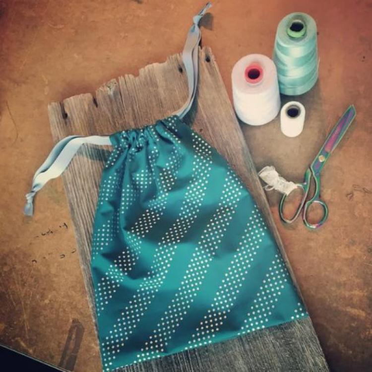 Drawstring bag example with scissors and thread