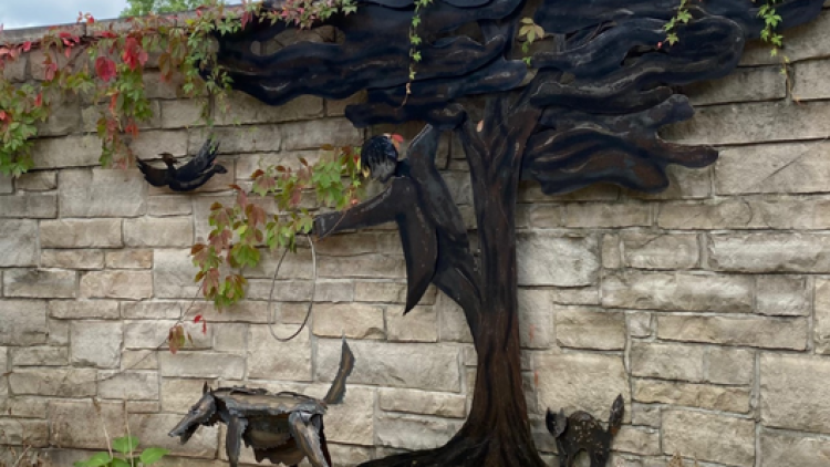 Peter and the Wolf in the Courtyard, a sculpture by Michael Pocock