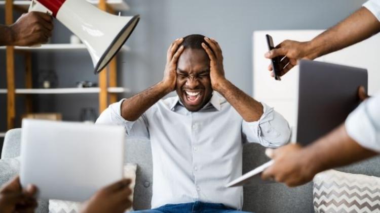 A man is bombarded by incoming information
