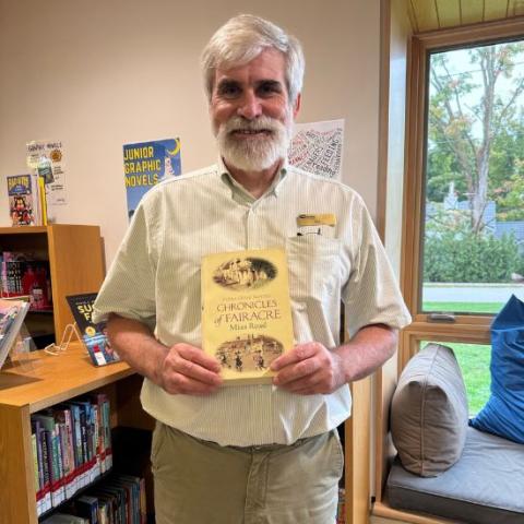Ken holding The Chronicles of Fairacre