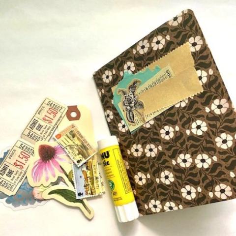 Scrapbook with art supplies and glue
