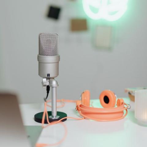 Microphone with headphones and laptop