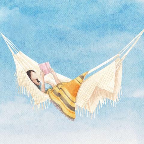 A woman reading in a hammock
